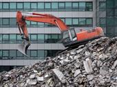commercial demolition with dumpster