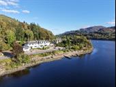 established attractive 12-bedroom lochside